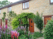 Photo of Front of Cottage and Garden